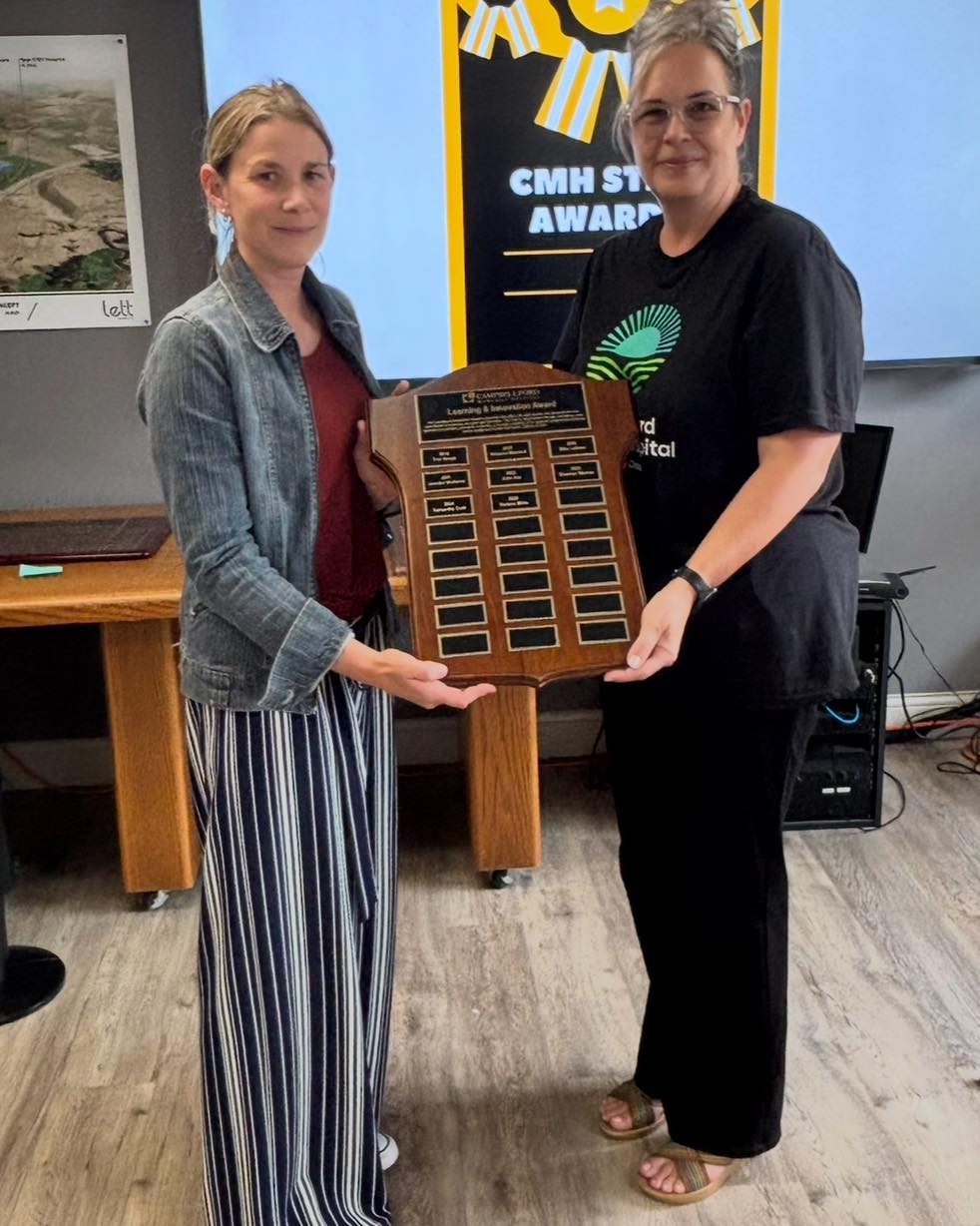 Darlene Milne receiving award
